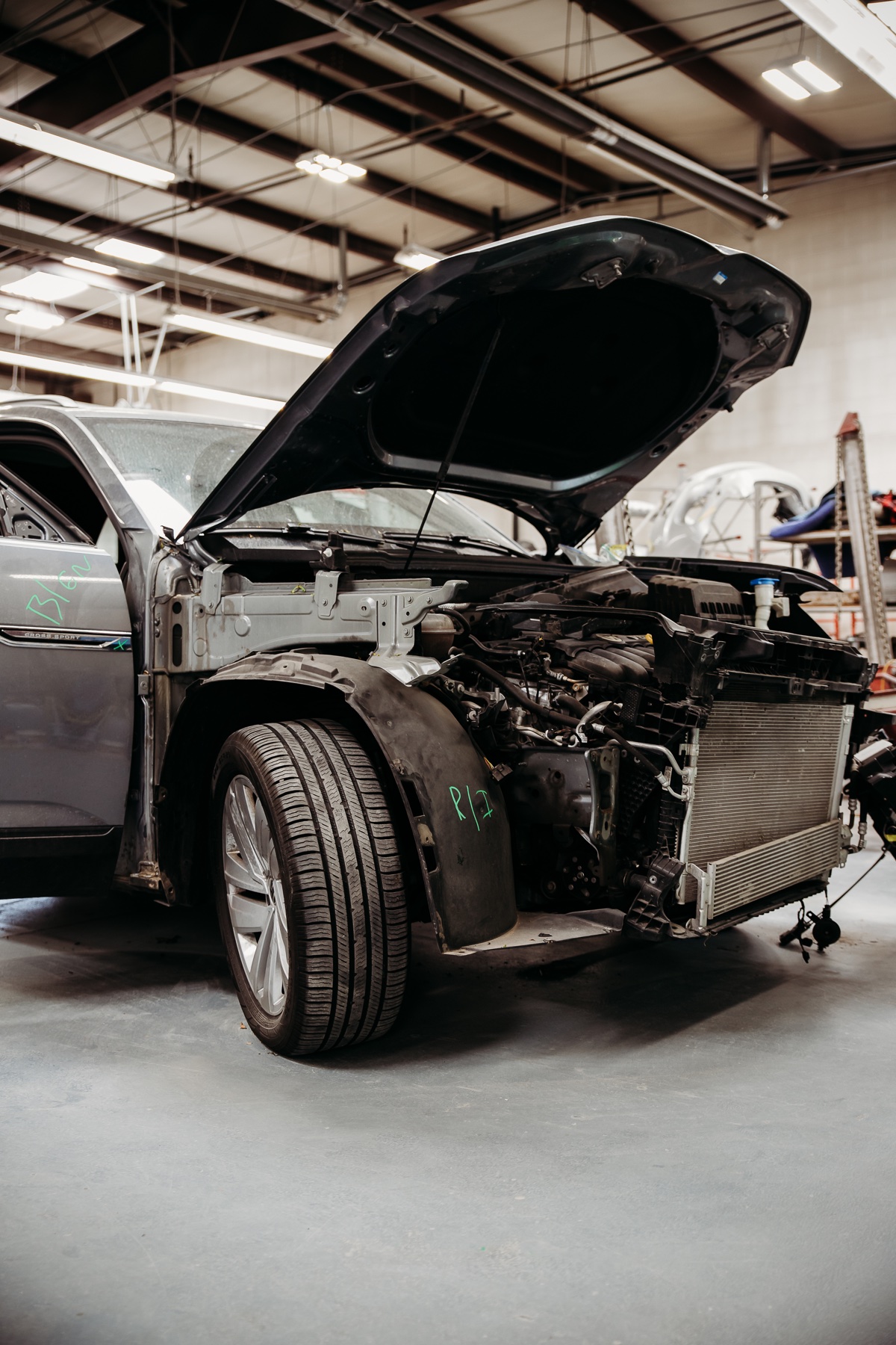 Vehicle disassembled for collision repair at Crazy Color